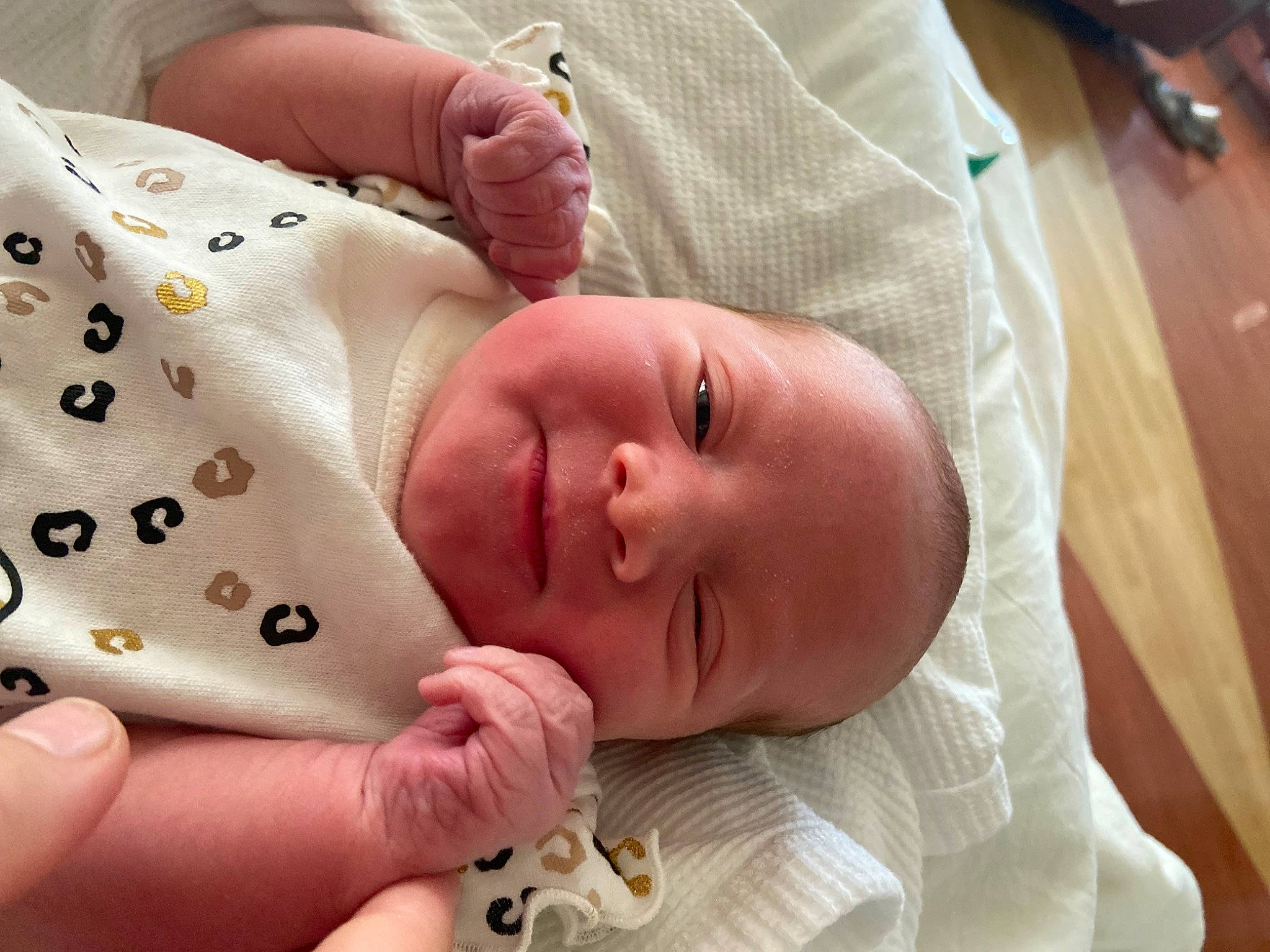 Aria joined the competition — help win amazing prizes! baby, baby_products, baby_sleeping, baby_toddler_clothing, child, comfort, facial_expression, finger, foot, gesture, linens, mouth, nail, nose, person, skin, sleeve, thumb, toddler, white