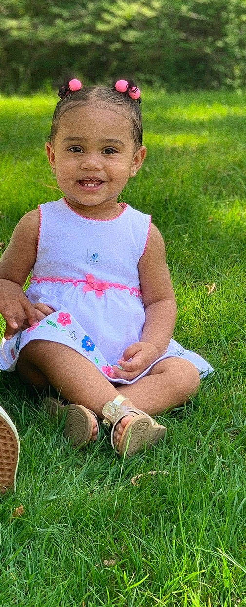 Erynn is registered to the contest to win money with this photo: baby, baby_toddler_clothing, child, child_model, grass, grass_family, happy, joy, lawn, leg, meadow, person, plant, play, sitting, smile, summer, toddler