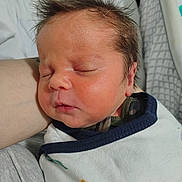 James joined the competition — help win amazing prizes! baby, newborn, sleeping, infant, swaddled, blanket, face, hair, closed_eyes, person, skin, peaceful, cute, resting, indoors, bed, arm, clothing, soft_light, portrait