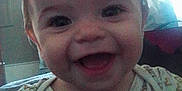 Aurora is registered to the contest to win money with this photo: apparel, baby, babywear, child, closeup, clothing, cute, expression, face, happy, head, heart_pattern, human, indoor, infant, person, portrait, smiling, toddler, young_child