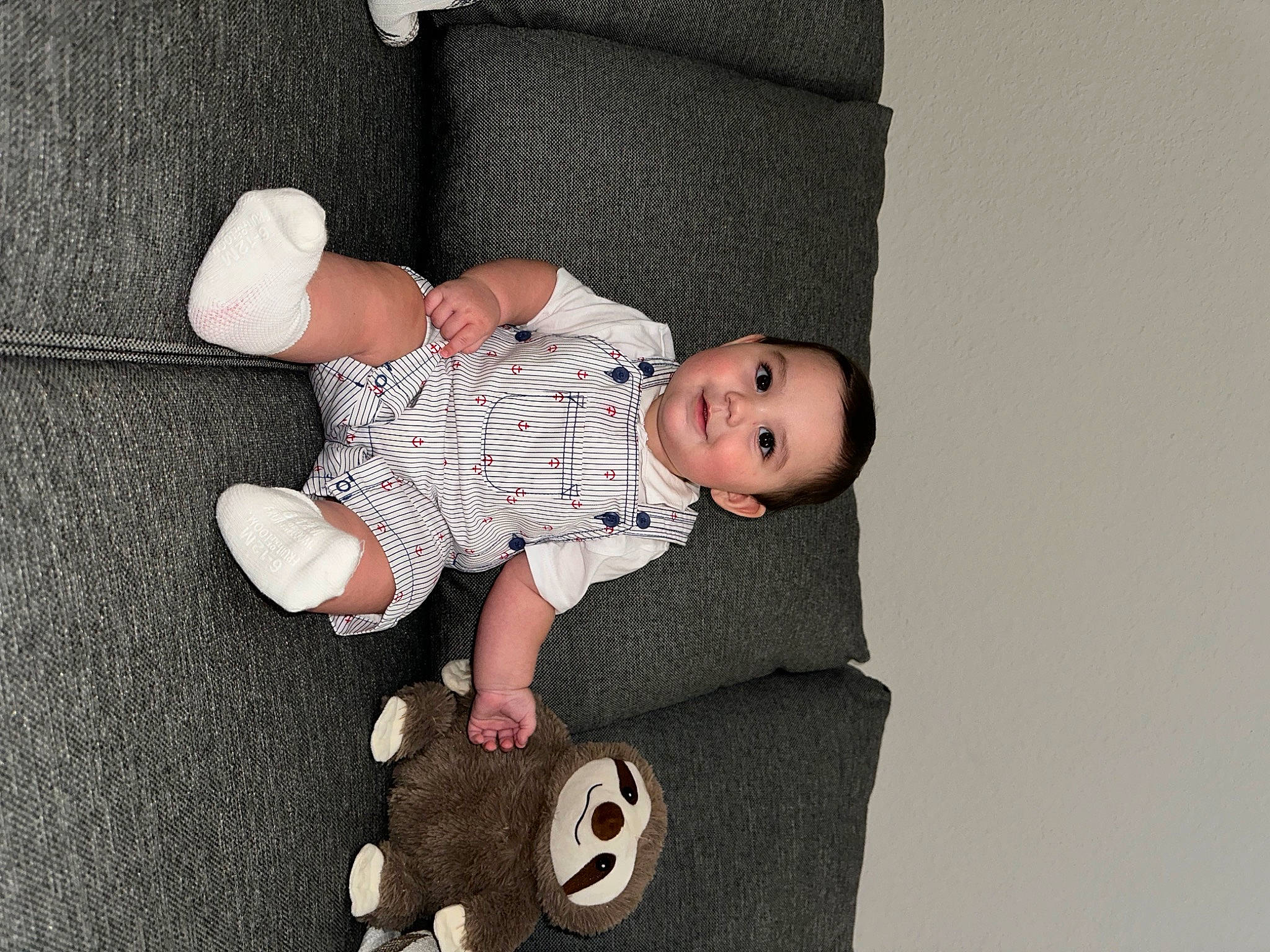 Draco joined the competition — help win amazing prizes! baby, baby_toddler_clothing, child, comfort, facial_expression, finger, flash_photography, flooring, foot, happy, joy, leg, pattern, person, room, sitting, skin, sleeve, sock, toddler