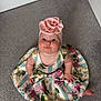 Aurora is registered to the contest to win money with this photo: baby, child, infant, girl, dress, floral_pattern, headband, flower, carpet, indoor, floor, door, curious, sitting, cute, chubby_cheeks, blue_eyes, portrait, person, smile