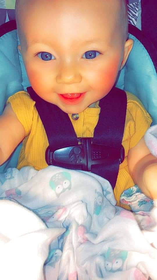 Hazel Rose is registered to the contest to win money with this photo: arm, baby, blue, cheek, chin, eye, eyebrow, facial_expression, finger, gesture, happy, human_body, iris, lip, mouth, nose, organ, person, product, skin