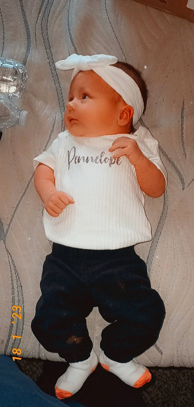 Pennelope joined the competition — help win amazing prizes! baby, baby_products, baby_toddler_clothing, beanie, cap, cheek, child, cool, fashion_accessory, hat, human, human_body, iris, lip, pattern, person, sitting, skin, sleeve, t_shirt