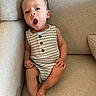 James joined the competition — help win amazing prizes! baby, infant, couch, furniture, clothing, onesie, striped, buttons, sitting, cute, expression, face, skin, legs, arms, toes, indoors, soft, comfortable, child