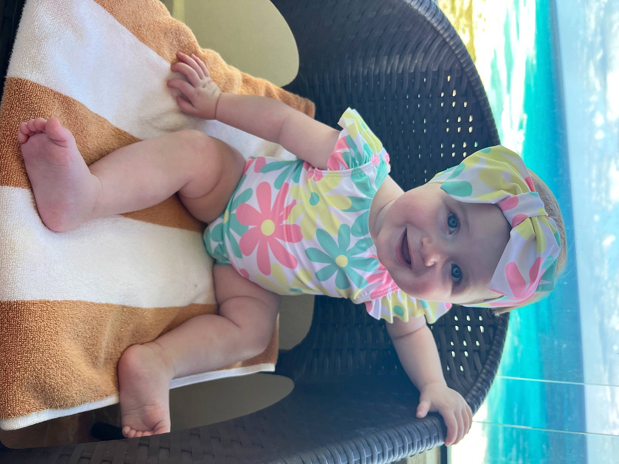 Laurencie is registered to the contest to win money with this photo: arm, baby, baby_toddler_clothing, child, comfort, facial_expression, hand, happy, hat, headgear, headwear, human_body, human_leg, joy, leisure, pattern, person, pink, skin, smile