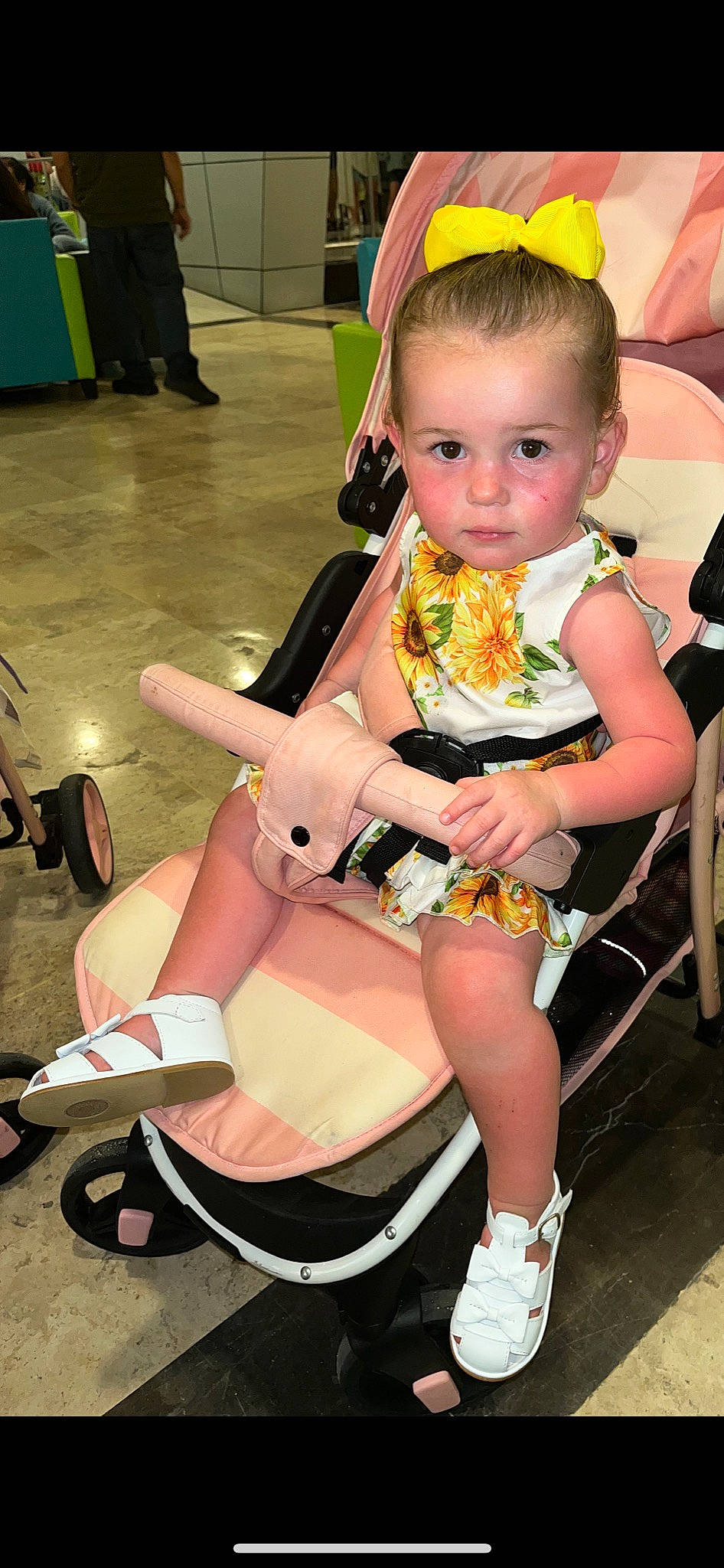Paisley is registered to the contest to win money with this photo: beauty, chair, event, fashion, footwear, fun, hairstyle, happy, human_leg, knee, lap, leg, person, sandal, shoe, skin, snapshot, sneakers, thigh, toddler