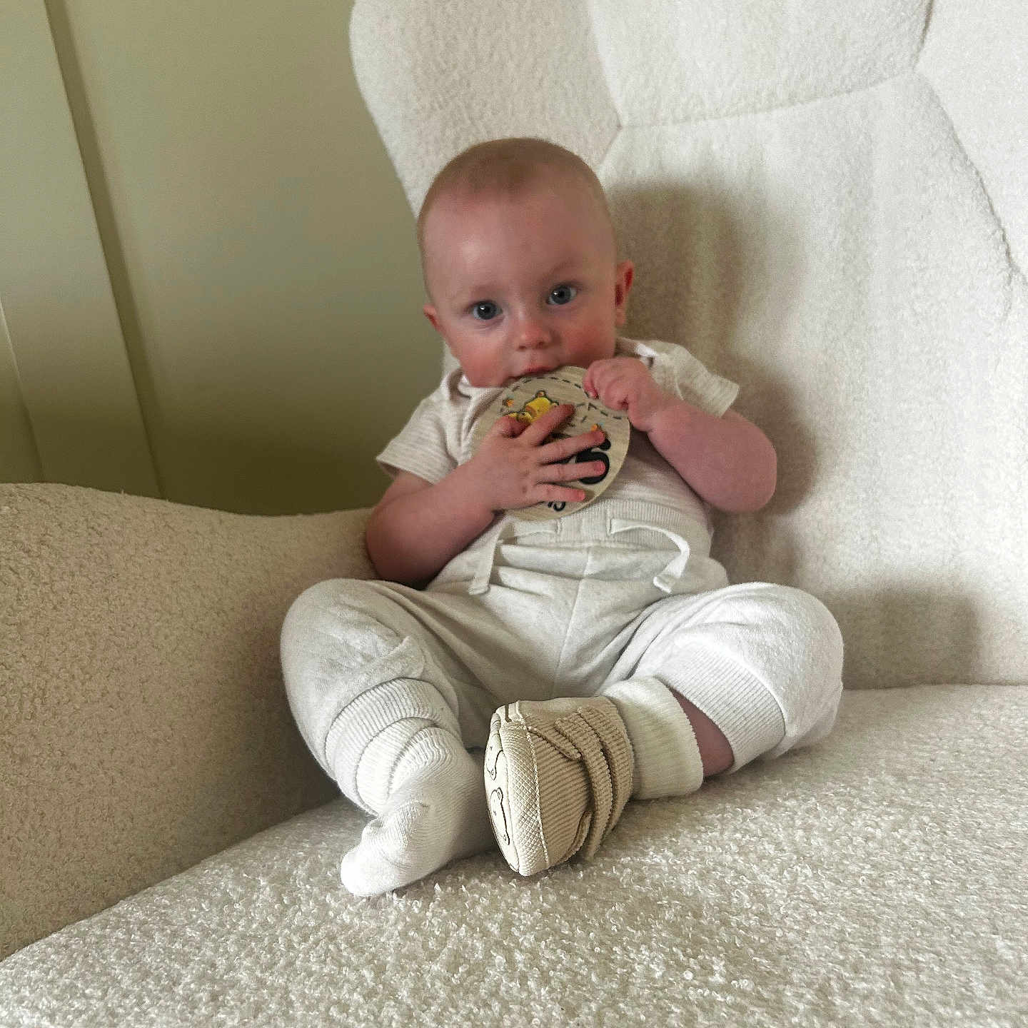 Odhrán is registered to the contest to win money with this photo: armchair, baby, child, clothing, comfort, cozy, cute, footwear, furniture, indoor, infant, person, portrait, relaxed, sitting, socks, soft, toy, white, young