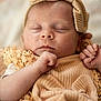 baby, sleeping, newborn, headband, bow, knitted, soft, beige, cozy, closeup, infant, cute, peaceful, wrapped, texture, portrait, hand, child, resting, warm