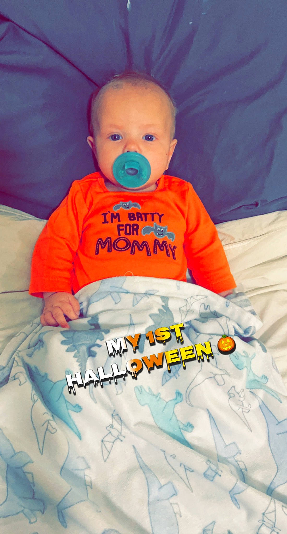 Prestyn is registered to the contest to win money with this photo: baby, baby_products, baby_safety, baby_sleeping, baby_toddler_clothing, bedding, child, comfort, font, fun, happy, linens, orange, person, product, room, sitting, sleeve, t_shirt, textile