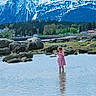 child, girl, water, rocks, mountains, snow, nature, outdoor, dress, reflection, forest, scenic, landscape, playful, summer, shallow_water, greenery, sky, calm, daytime