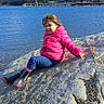 Scarlett joined the competition — help win amazing prizes! blue_sky, boots, casual_clothing, child, daylight, forest, girl, jacket, lake, mountain, nature, outdoor, pink_jacket, recreation, rock, scenic, sitting, sky, smiling, water
