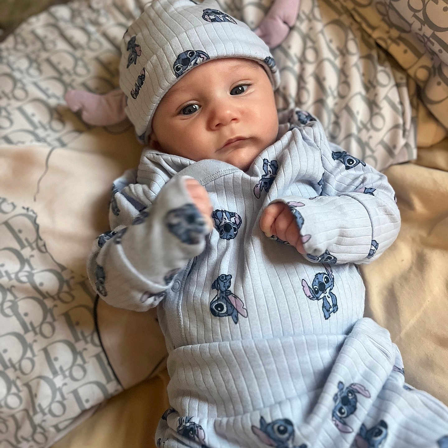 Albie-Joseph joined the competition — help win amazing prizes! baby, bed, blanket, child, clothing, comfort, cute, eyes, fabric, face, hand, hat, indoor, infant, lying_down, newborn, pattern, portrait, soft, stitch