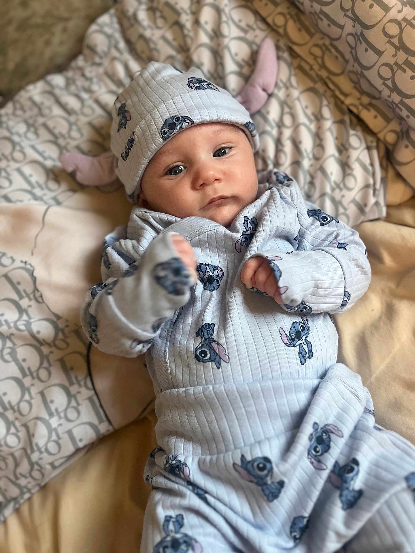 Albie-Joseph joined the competition — help win amazing prizes! baby, bed, blanket, child, clothing, comfort, cute, eyes, fabric, face, hand, hat, indoor, infant, lying_down, newborn, pattern, portrait, soft, stitch