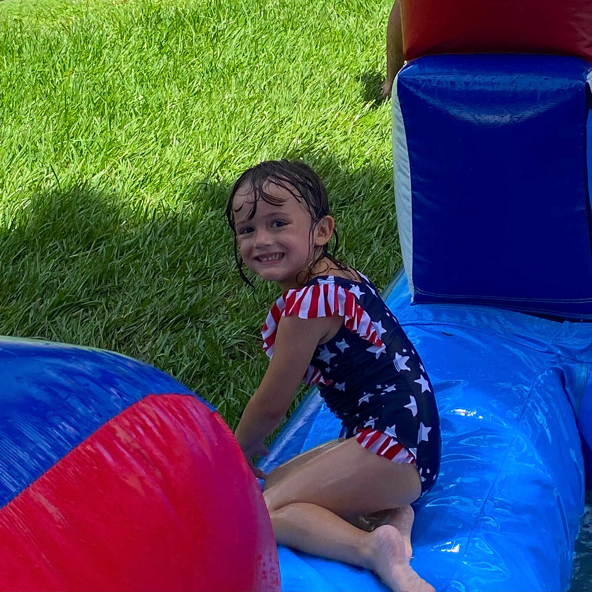 Holland joined the competition — help win amazing prizes! ball, child, face, female, football, girl, grass, head, inflatable, outdoors, person, photography, plant, playarea, portrait, slide, soccer, soccerball, summer, toy