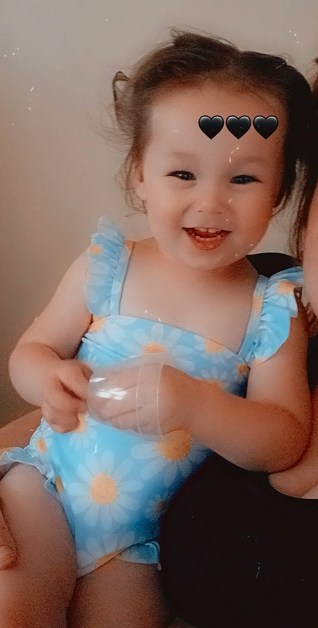 Haylie is registered to the contest to win money with this photo: aqua, azure, baby_toddler_clothing, eyewear, face, facial_expression, flash_photography, fun, goggles, happy, iris, joy, lip, organ, person, pink, product, skin, smile, toddler