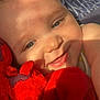 baby, child, smiling, face, blue_eyes, plush_toy, red, disney, soft_toy, cuddling, sunlight, shadow, striped_background, closeup, cute, happy, infant, person, indoors, warm_light