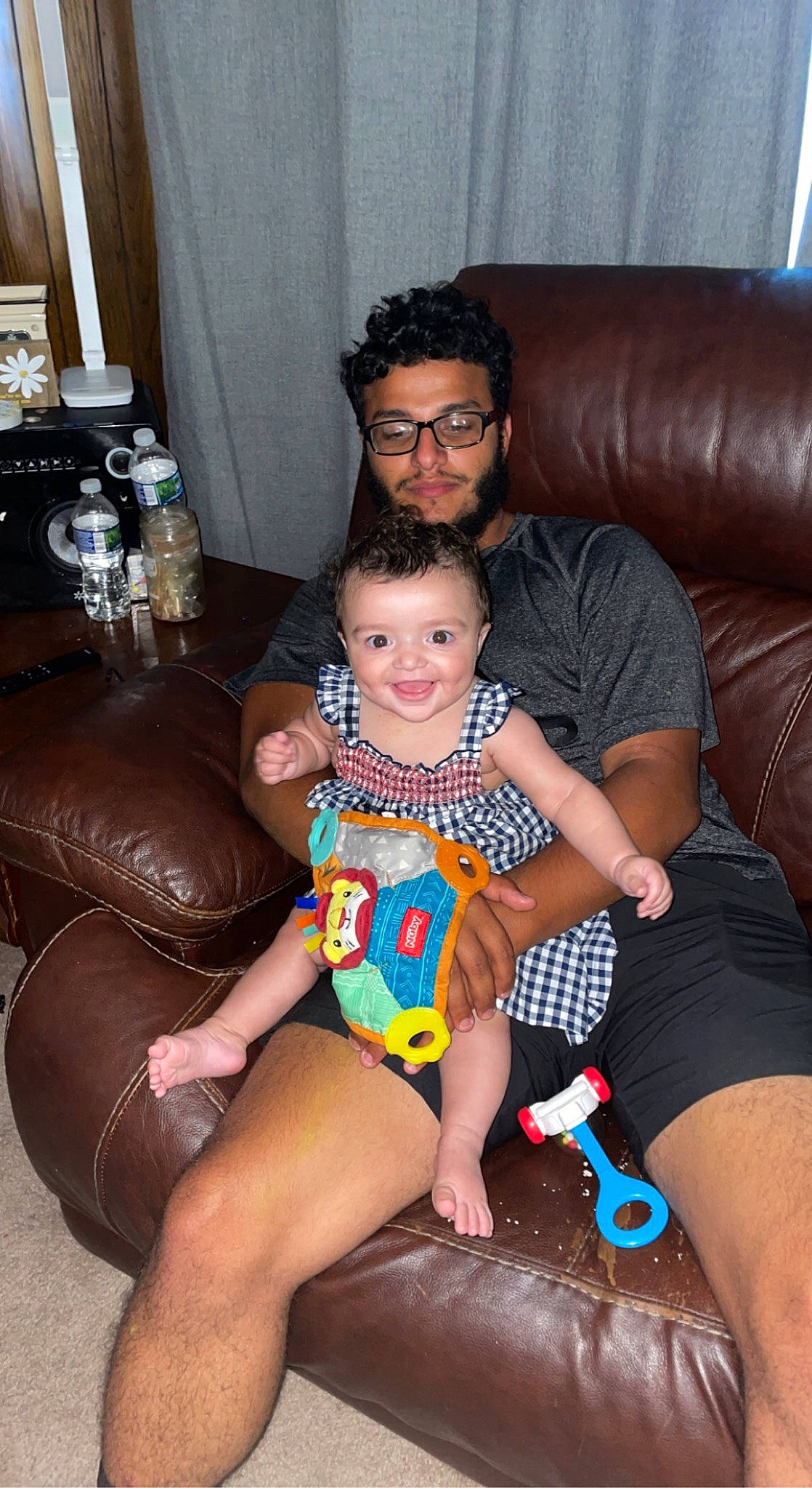 Yasmin joined the competition — help win amazing prizes! comfort, couch, event, eyewear, face, fun, glasses, happy, human_body, human_leg, joy, lap, leg, leisure, living_room, mouth, muscle, person, shorts, sitting