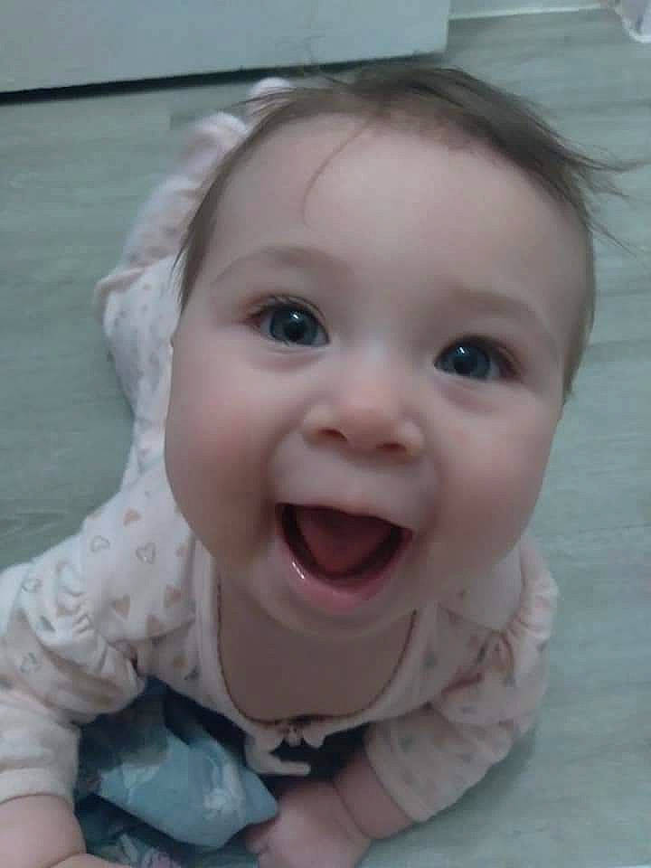 Maddie is registered to the contest to win money with this photo: baby, baby_toddler_clothing, cheek, ear, eyebrow, eyelash, gesture, hair, happy, iris, lip, mouth, neck, nose, person, product, skin, sleeve, smile, toddler