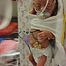 newborn, infant, baby, hospital, incubator, neonatal_care, medical_equipment, tubes, pacifier, blanket, swaddled, sleeping, face, hands, feet, portrait, indoor, healthcare, premature_baby, monitoring