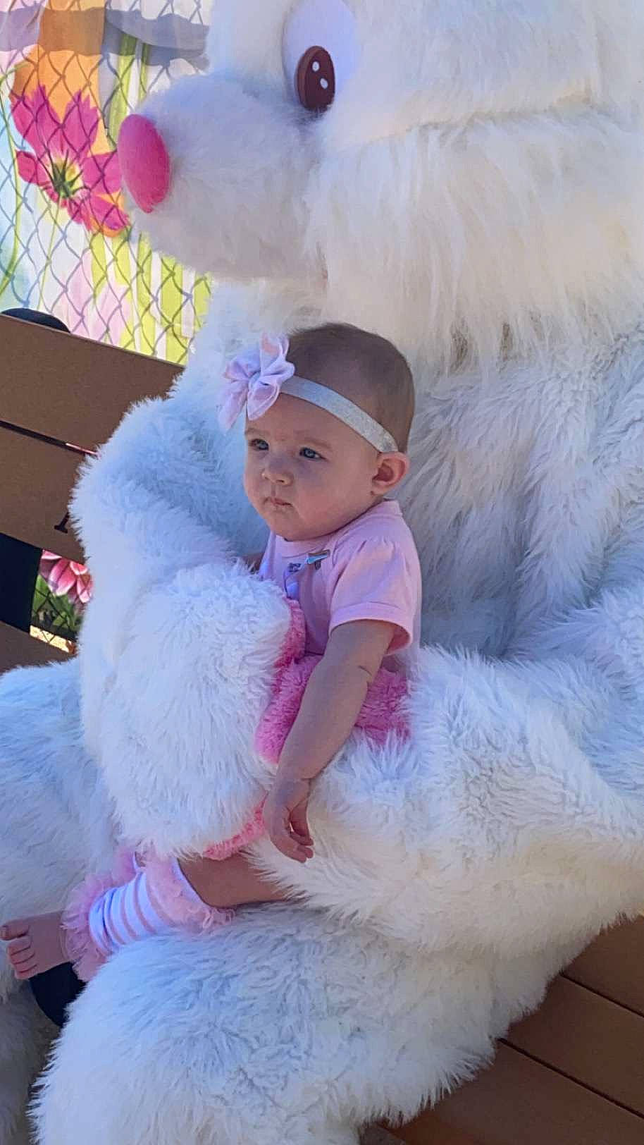 Athena is registered to the contest to win money with this photo: baby, baby_toddler_clothing, cap, child, costume, costume_hat, dress, fun, fur, fur_clothing, happy, headgear, headwear, magenta, person, pink, plush, purple, stuffed_toy, textile