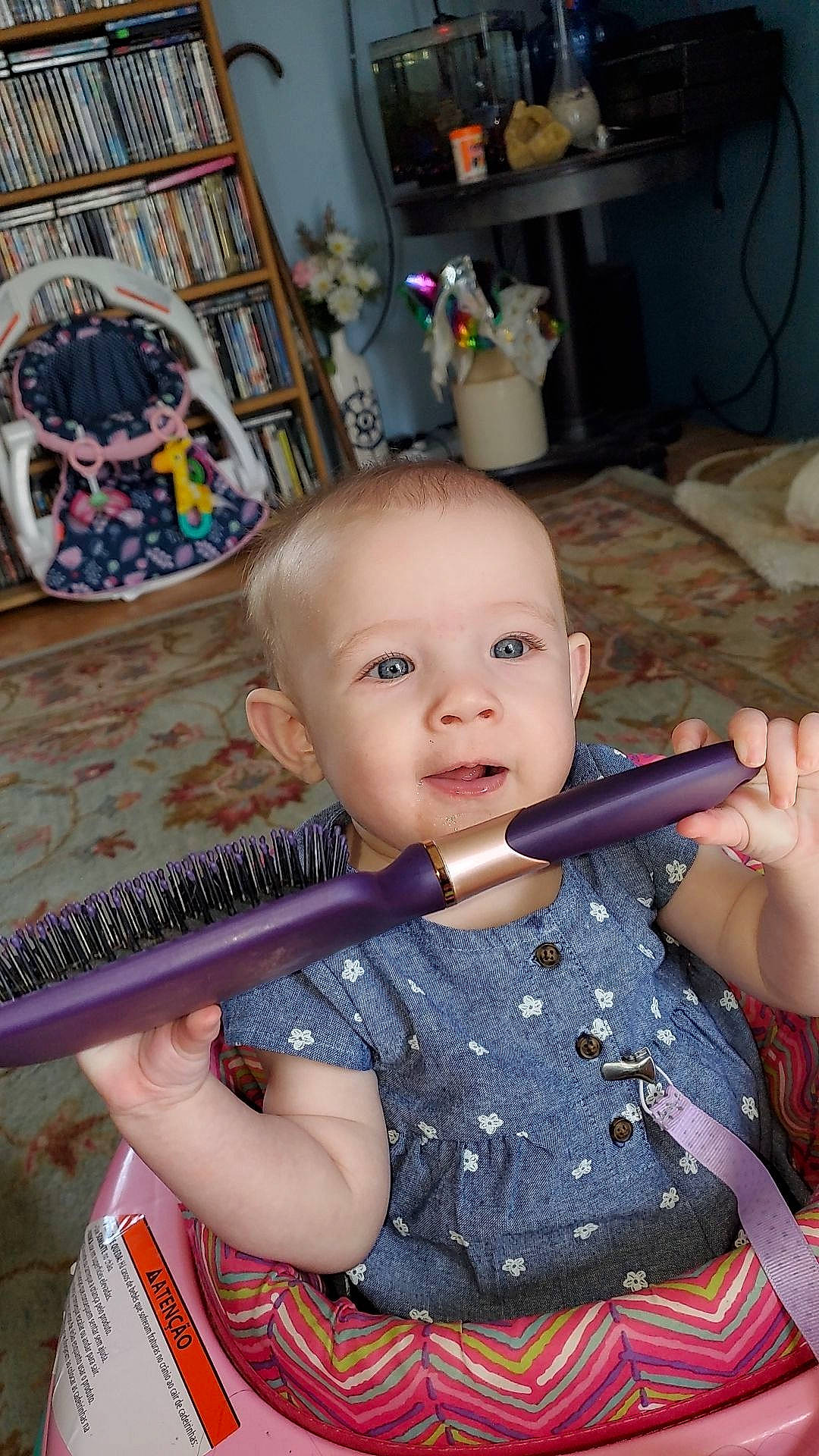 Athena joined the competition — help win amazing prizes! baby, baby_products, bookcase, chair, cheek, child, fun, hand, iris, lap, pattern, person, play, room, shelf, shelving, sitting, skin, smile, toddler