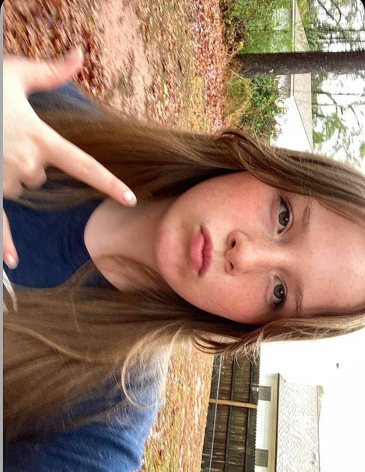 Kandice is registered to the contest to win money with this photo: beauty, brown_hair, eyelash, face, flash_photography, fun, grass, hair, happy, human_leg, jaw, leisure, lip, long_hair, people_in_nature, person, photograph, plant, skin, tree