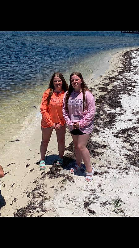 Katie is registered to the contest to win money with this photo: beach, coastal_and_oceanic_landforms, event, flash_photography, fun, happy, holiday, horizon, joy, lake, landscape, leg, leisure, nature, people_in_nature, people_on_beach, person, recreation, smile, summer