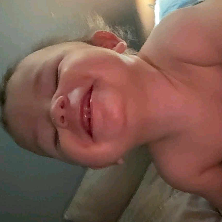 Josiah Morales joined the competition — help win amazing prizes! baby, cheerful, child, closeup, comfort, couch, expression, face, happy, head, indoor, joy, light, person, portrait, relaxing, room, skin, smiling, toddler