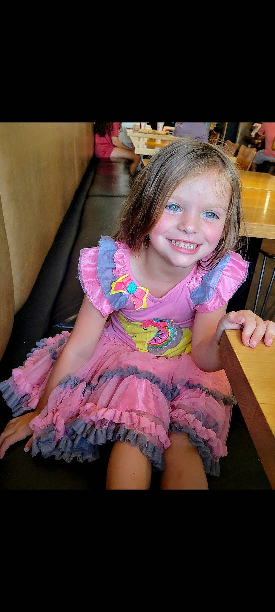 Ella-rae is registered to the contest to win money with this photo: baby_toddler_clothing, chair, dress, embellishment, facial_expression, fun, hairstyle, happy, iris, joy, long_hair, magenta, person, pink, purple, shoulder, skin, smile, table, textile