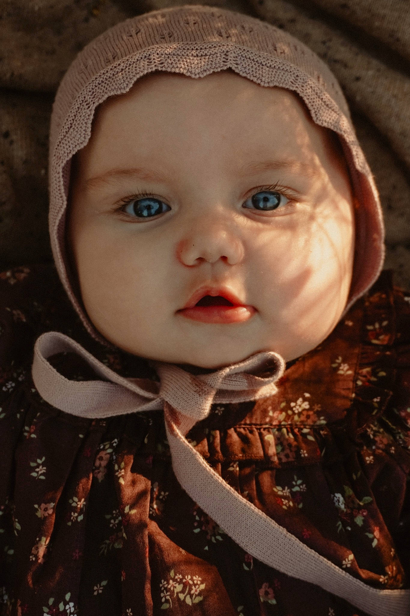 Lottie is registered to the contest to win money with this photo: baby, baby_toddler_clothing, cap, cheek, child, chin, fashion_accessory, flash_photography, hat, headgear, headwear, iris, lip, nose, outerwear, person, plant, skin, sleeve, sun_hat