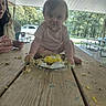 baby, child, cake, smiling, eating, messy, birthday, picnic, outdoor, park, picnic_table, table, adult, face, portrait, sitting, food, frosting, trees, daylight