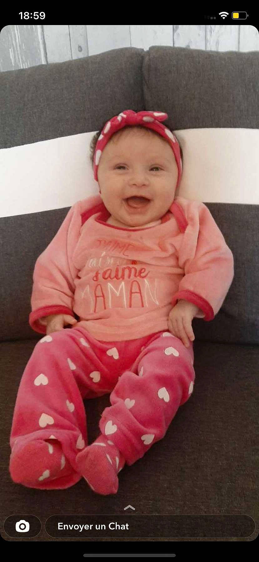 Marie participe au concours pour gagner de l'argent avec cette photo : baby, baby_laughing, baby_toddler_clothing, cheek, comfort, eye, face, happy, head, headwear, human_body, lip, outerwear, person, pink, product, skin, sleeve, smile, standing