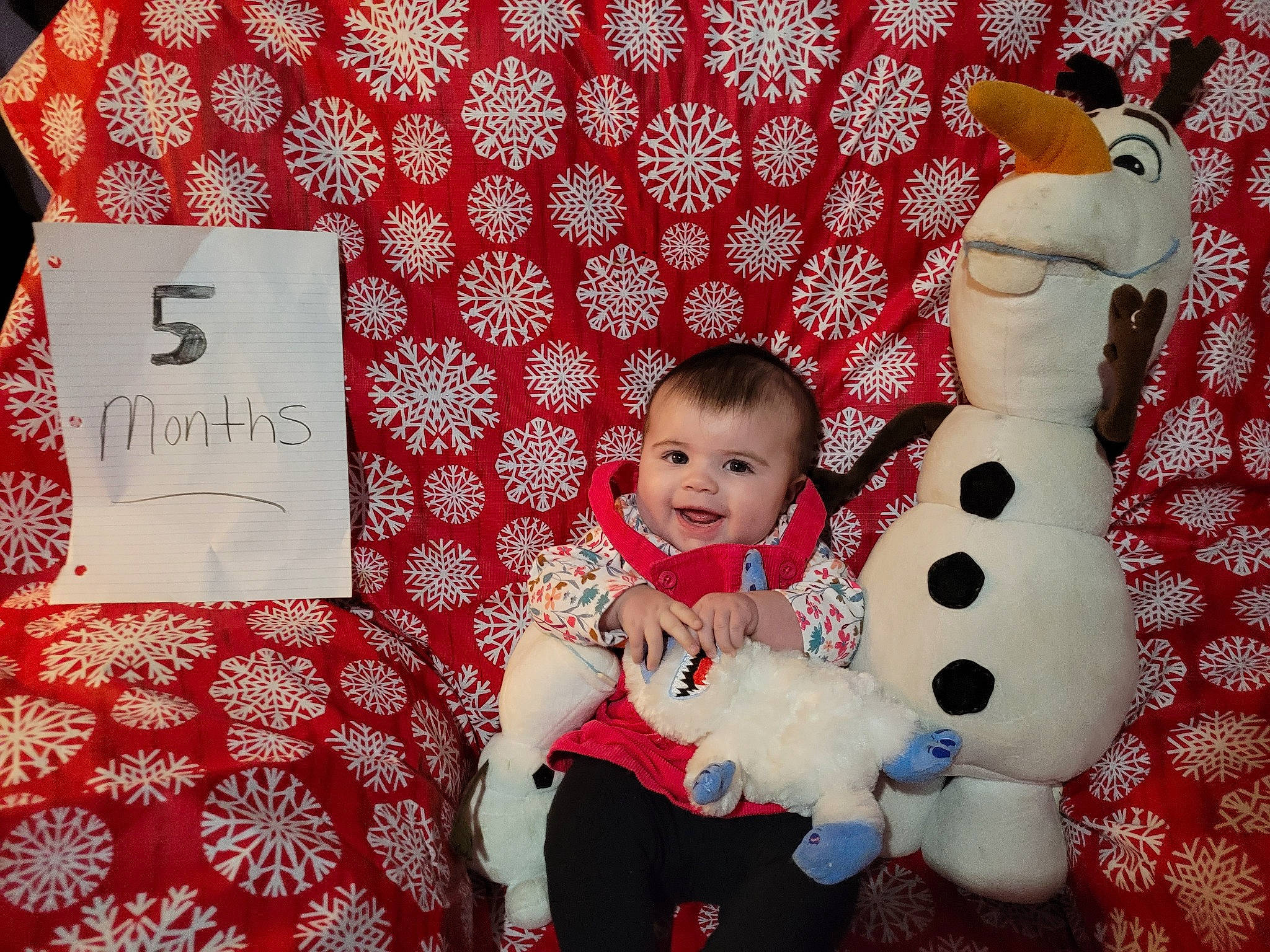 Anna is registered to the contest to win money with this photo: baby_toddler_clothing, carmine, christmas, christmas_decoration, christmas_eve, christmas_ornament, event, happy, holiday, joy, linens, ornament, pattern, person, pink, red, room, smile, stuffed_toy, textile