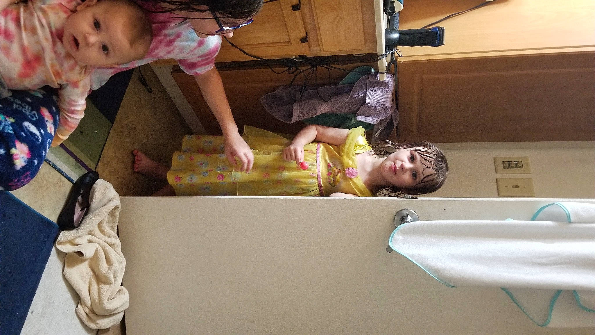 Lily is registered to the contest to win money with this photo: arm, baby, baby_products, baby_toddler_clothing, box, ceiling, child, comfort, eye, facial_expression, fun, head, mouth, person, room, shorts, skin, toddler, wood