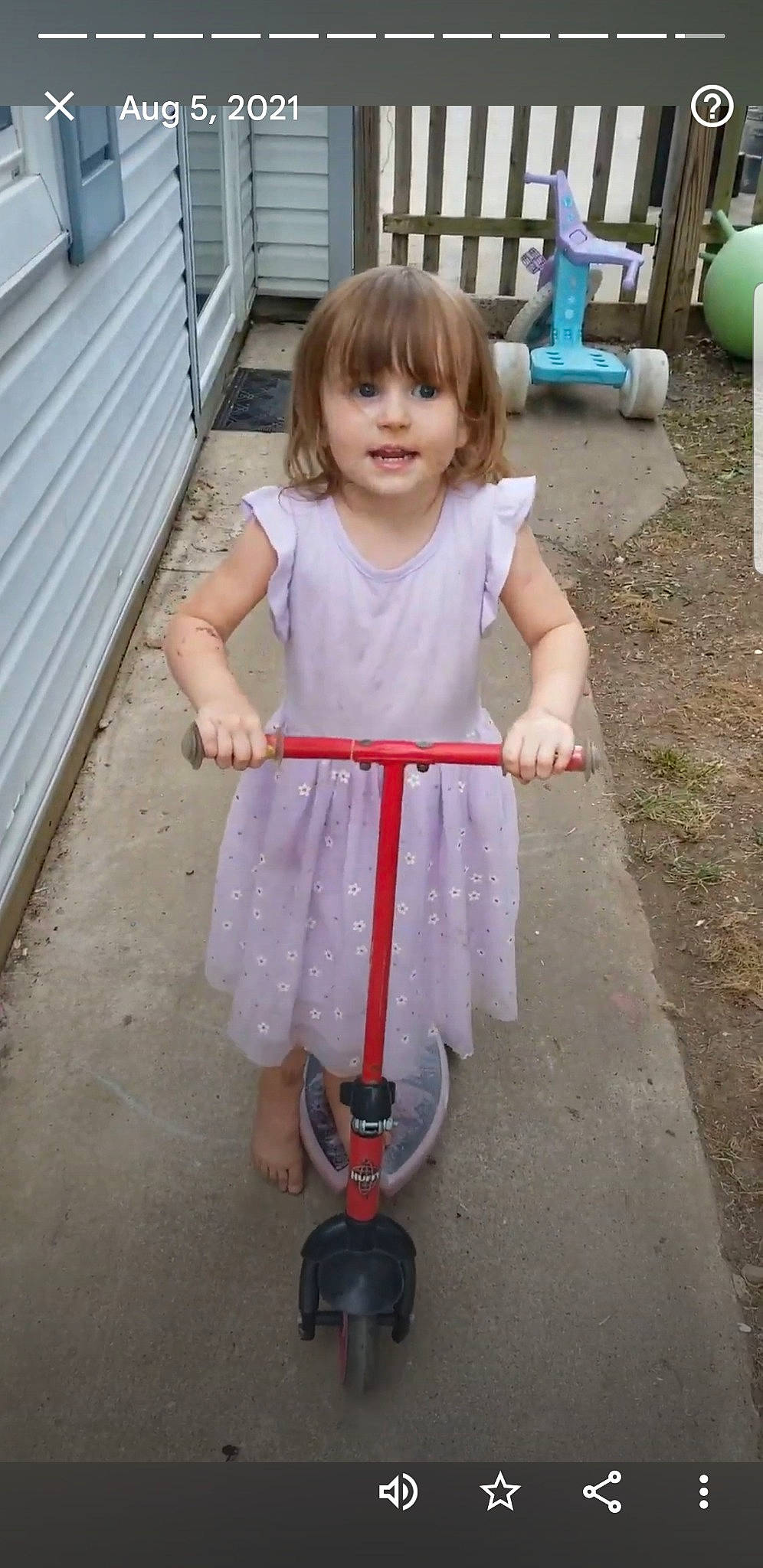 Lily joined the competition — help win amazing prizes! baby_toddler_clothing, child, dress, fun, grass, kick_scooter, leg, magenta, person, photograph, pink, recreation, riding_toy, sidewalk, sitting, smile, standing, tire, toddler, wheel
