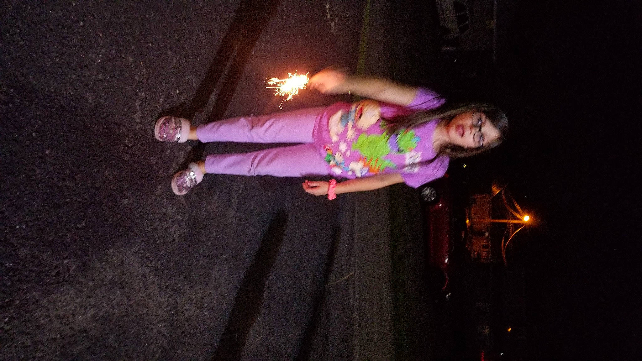 Makala is registered to the contest to win money with this photo: child, darkness, entertainment, event, fun, magenta, night, performance, performance_art, performing_arts, person, pink, plant, purple, room, toddler, walking_shoe