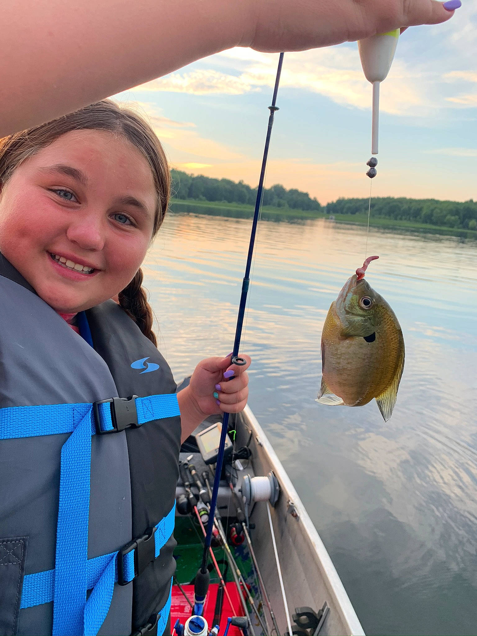 Gabby is registered to the contest to win money with this photo: angling, bait, boat, fish, fish_hook, fisherman, fishing, fishing_reel, fishing_rod, headwear, jigging, joy, lake, lifejacket, outdoor_recreation, person, ray_finned_fish, recreation, recreational_fishing, sound