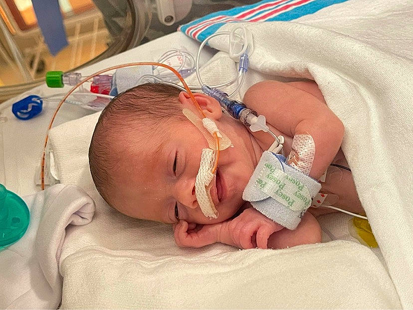 Novah is registered to the contest to win money with this photo: baby, baby_toddler_clothing, child, childbirth, comfort, ear, event, eye, finger, health_care, hospital, medical, medical_equipment, medical_procedure, mouth, patient, pediatrics, person, service, skin