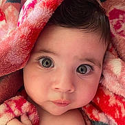 Héléna participe au concours pour gagner de l'argent avec cette photo : baby, child, face, eyes, blanket, hand, skin, infant, closeup, expression, cute, soft, warm, portrait, wrapped, cozy, comfort, pink, red, toddler