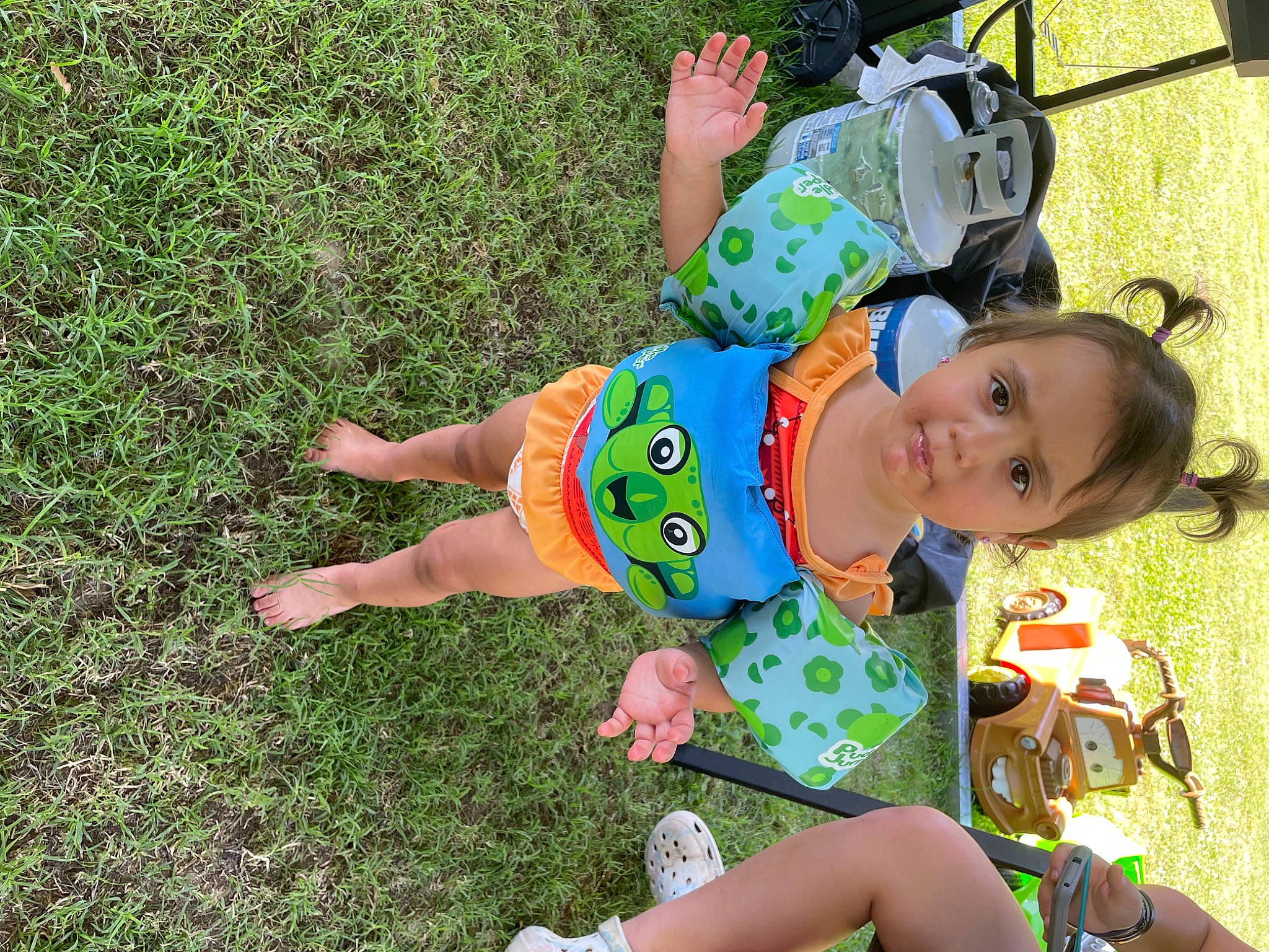 Rosa is registered to the contest to win money with this photo: baby, baby_products, baby_toddler_clothing, fun, grass, grass_family, groundcover, happy, hat, lawn, leisure, pattern, people_in_nature, person, recreation, sandal, shoe, sitting, spring, summer