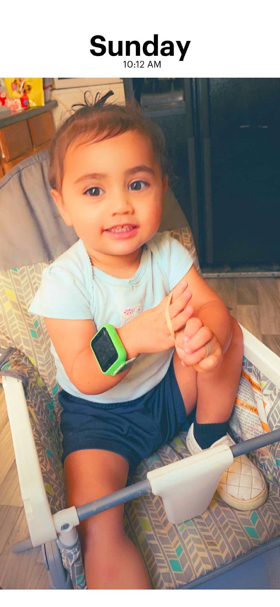 Rosa is registered to the contest to win money with this photo: arm, baby_toddler_clothing, chair, cheek, child, elbow, finger, fun, gesture, happy, joy, knee, leg, nail, person, shorts, skin, t_shirt, thigh, thumb