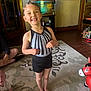 Arabella joined the competition — help win amazing prizes! child, baby, smile, happy, leotard, barefoot, indoor, carpet, toy, inflatable, living_room, person, crawling, furniture, painting, fish_tank, wood_floor, door, sitting, playful