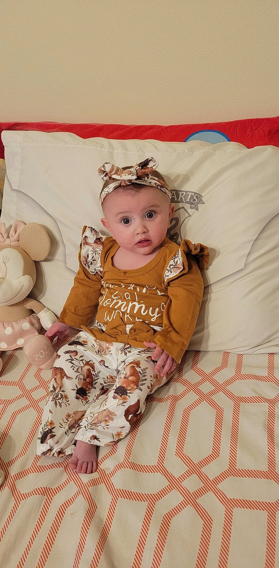 Hayleigh is registered to the contest to win money with this photo: baby, baby_products, baby_sleeping, baby_toddler_clothing, bedding, child, comfort, eye, fashion_accessory, happy, headband, headpiece, headwear, linens, pattern, peach, person, pink, sitting, skin