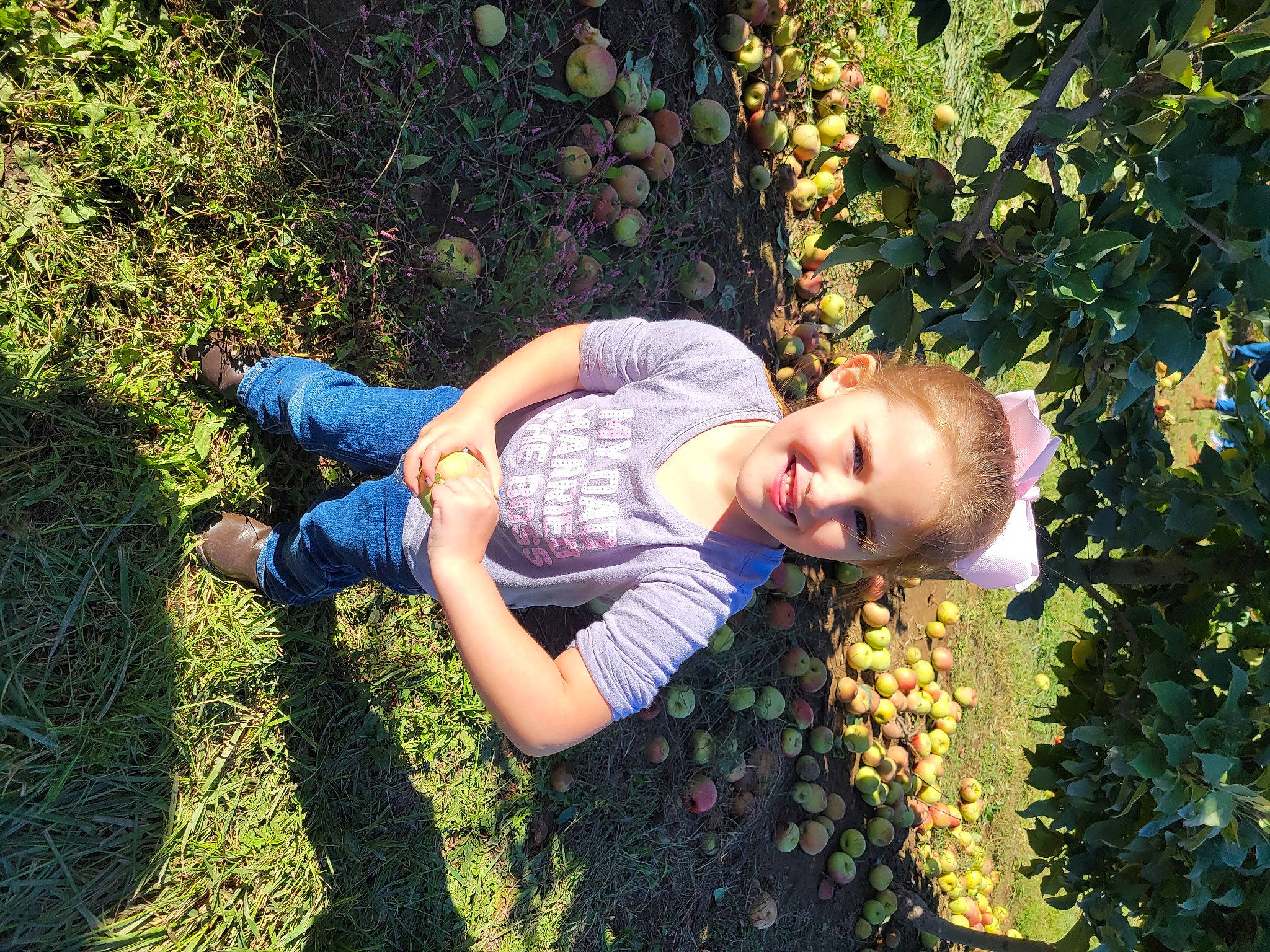 Chloe joined the competition — help win amazing prizes! botany, child, flower, fun, garden, grass, grassland, happy, joy, leisure, meadow, people_in_nature, person, plant, portrait_photography, shrub, sitting, smile, t_shirt, toddler