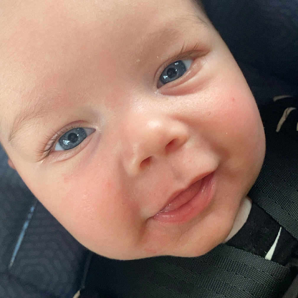 Mason is registered to the contest to win money with this photo: accessories, baby, belt, bodypart, clothing, coat, face, formalwear, happy, head, jacket, laughing, mouth, person, photography, portrait, selfie, smile, teeth, tie