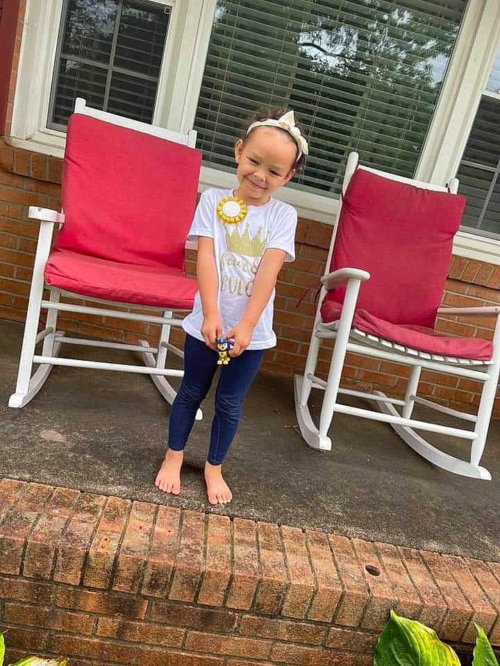 Marlii joined the competition — help win amazing prizes! chair, comfort, flooring, furniture, grass, green, joy, leisure, magenta, morning, outdoor_furniture, people_in_nature, person, plant, rectangle, red, shade, sitting, summer, toddler