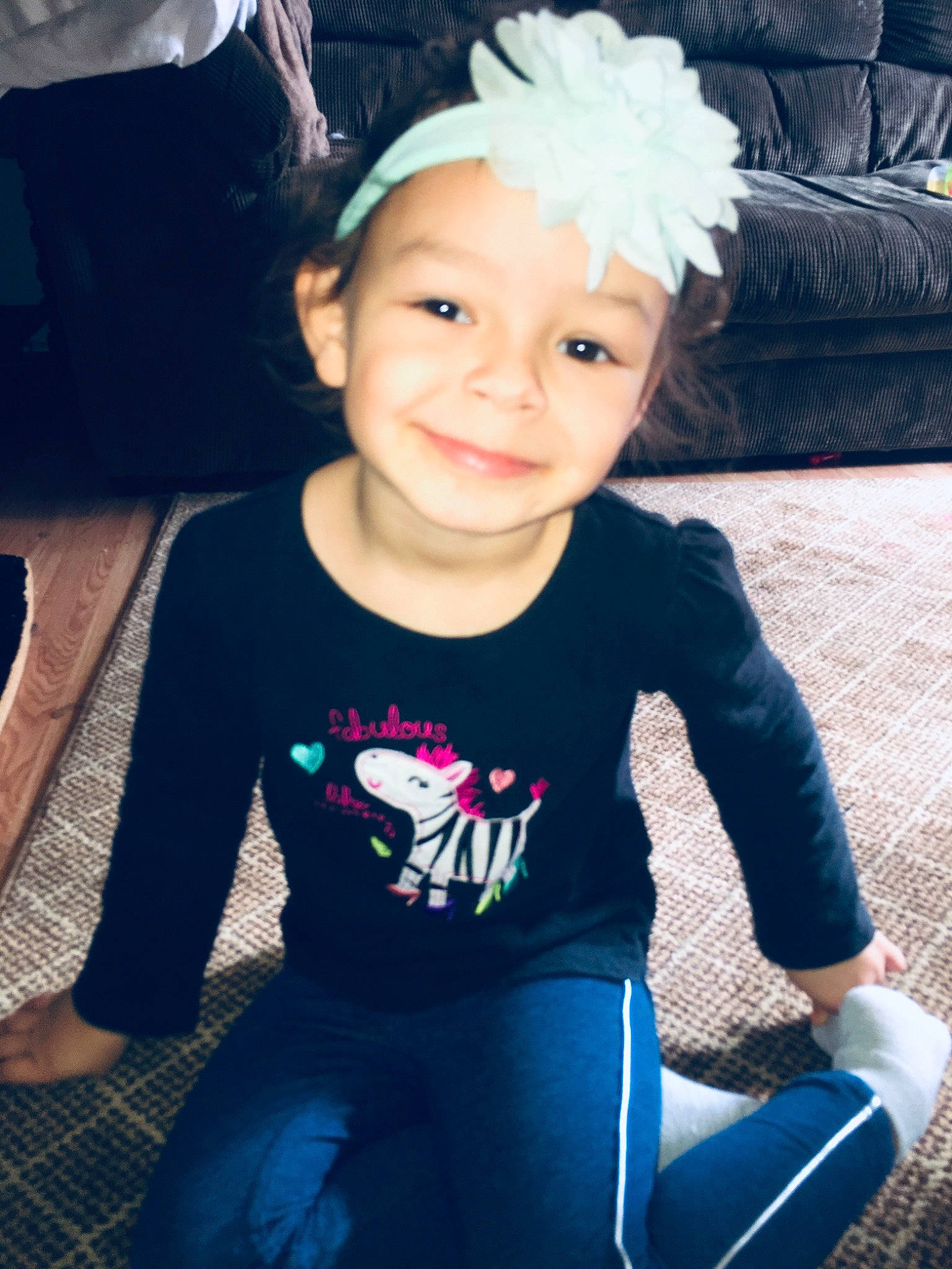 Marlii is registered to the contest to win money with this photo: baby, baby_toddler_clothing, child, child_model, cool, costume_accessory, couch, embellishment, eye, hair_accessory, happy, headband, headpiece, headwear, iris, joy, lap, living_room, person, sitting