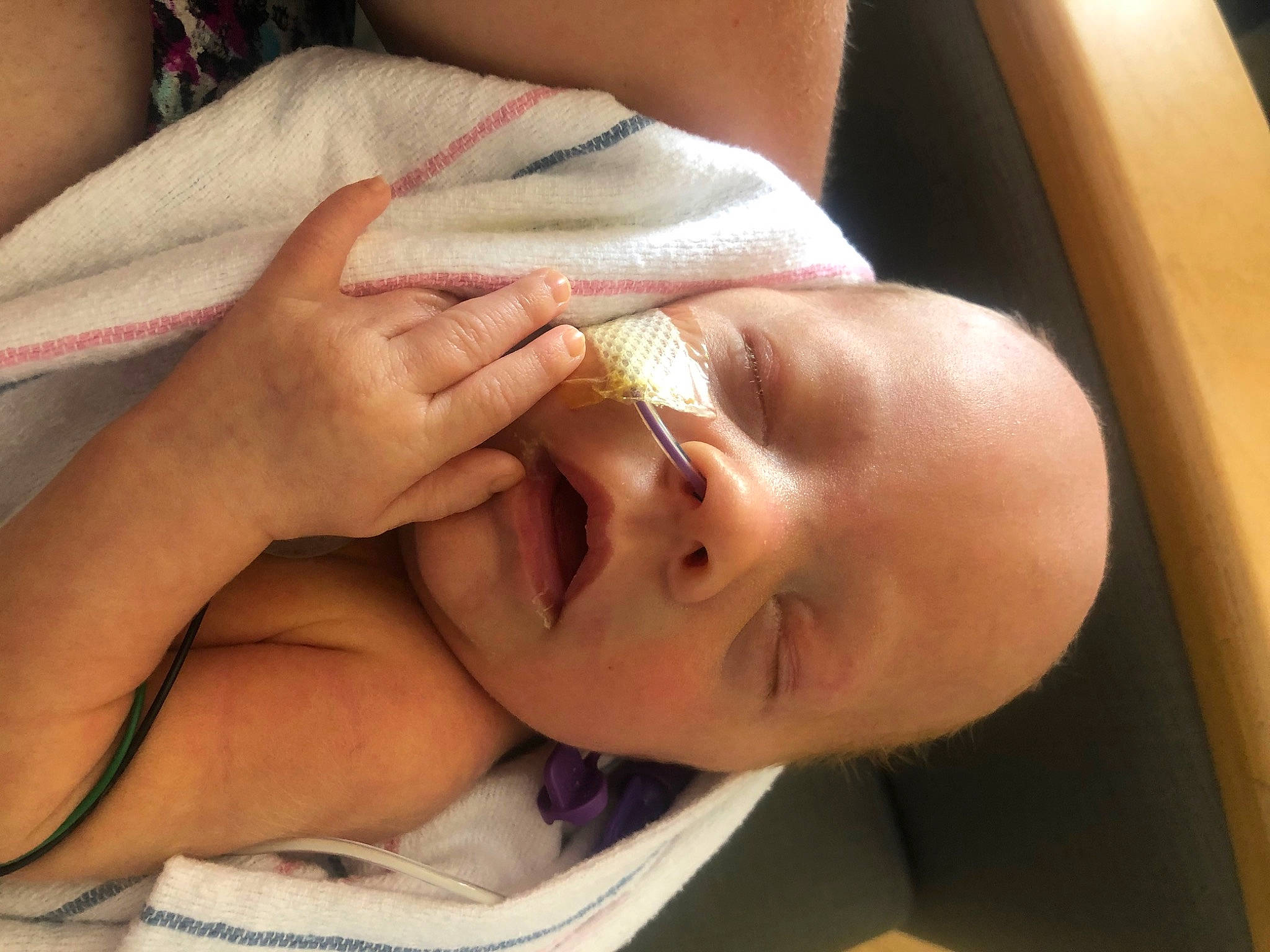 Flynn is registered to the contest to win money with this photo: baby, cheek, comfort, ear, eyelash, finger, gesture, hair, hand, happy, head, iris, jaw, lip, mouth, neck, nose, person, skin, thumb