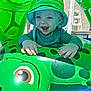 baby, blue_eyes, child, cute, fun, green_hat, hands, happy, inflatable_pool_toy, outdoor, play, pool, smiling, splash, summer, sun_hat, sunlight, turtle, vacation, water